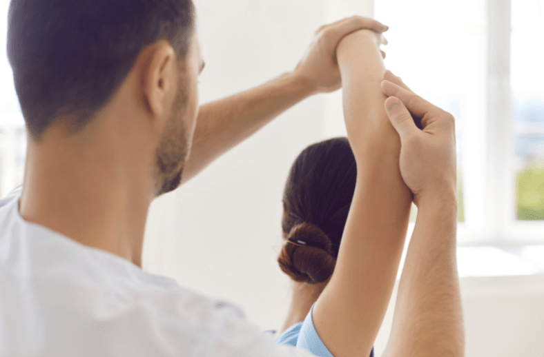 Chiropractor treating tennis elbow