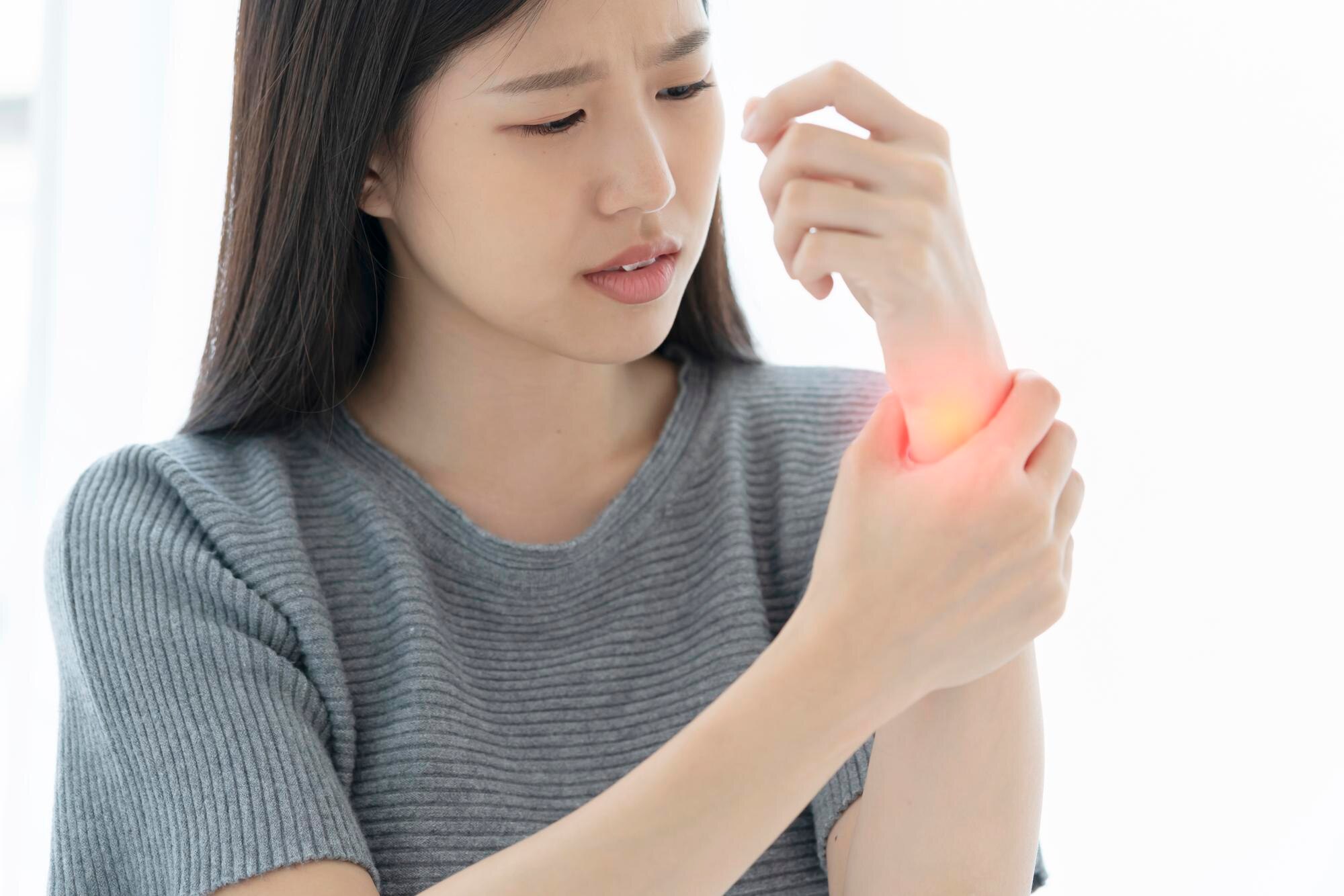 Sciatica & Disc Problems unhappy asian woman hand touch wrist with hand hurt from work exercise white background 609648 1614 - Sciatica & Disc Problems